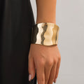 Irregular Metal Wide Curved Glossy Spring Bracelet - Norellé