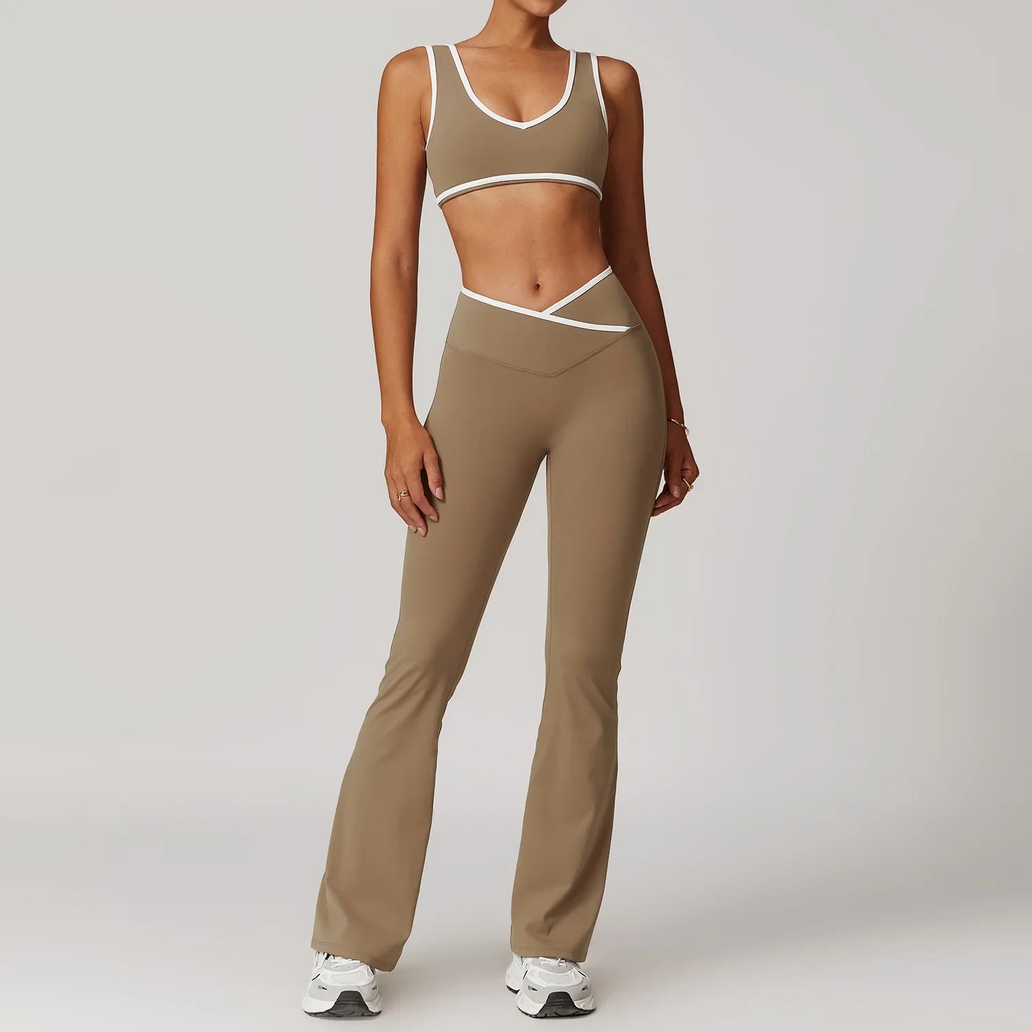 Olive green two-piece workout outfit fitness sportswear with white trim and flared yoga pants