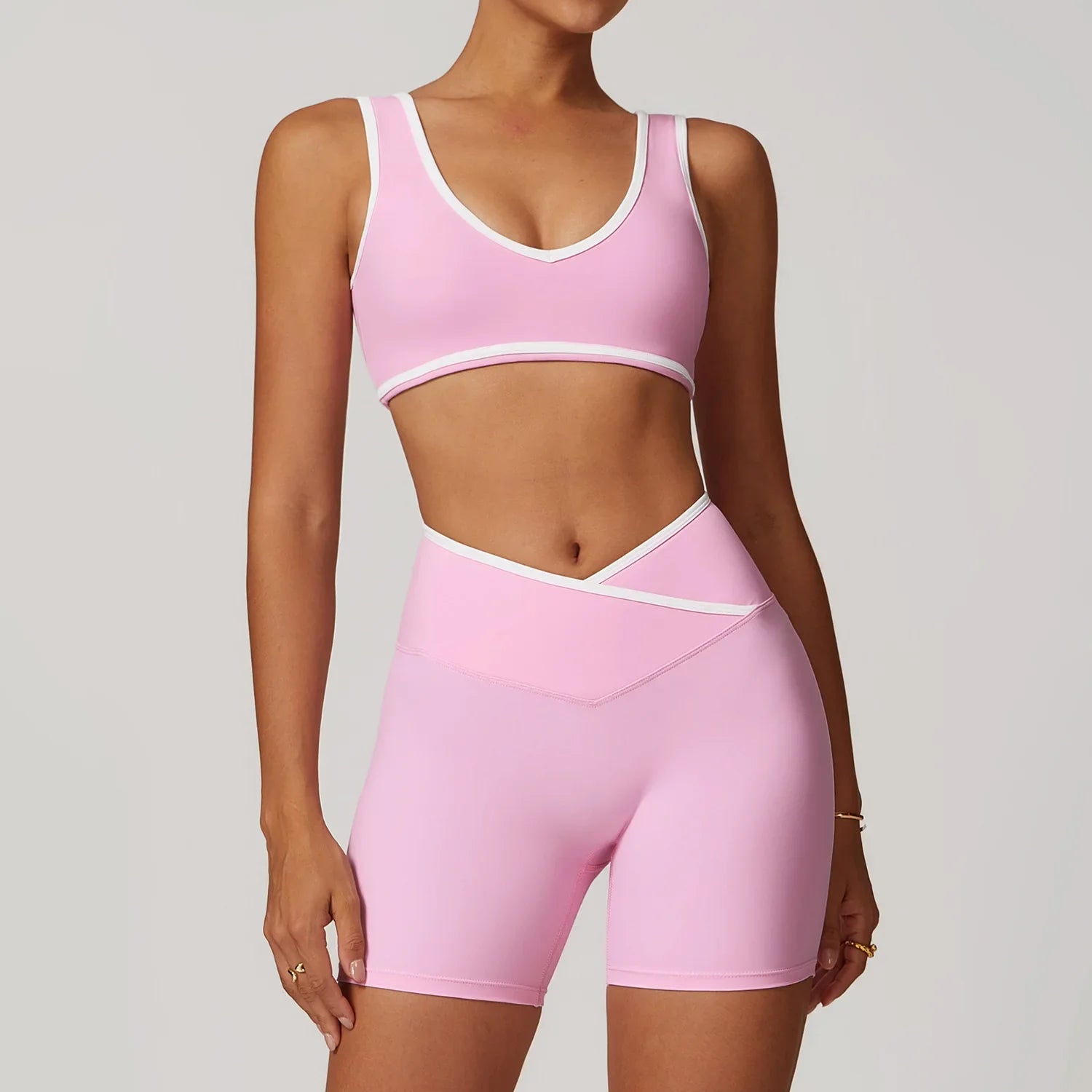 Light pink athletic bra top and matching high-waisted biker shorts from Blue-Grey Workout Outfit Fitness Sportswear