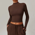 Dark brown long sleeve yoga cropped top with mock neck and thumbholes, ideal for sports yoga long sessions