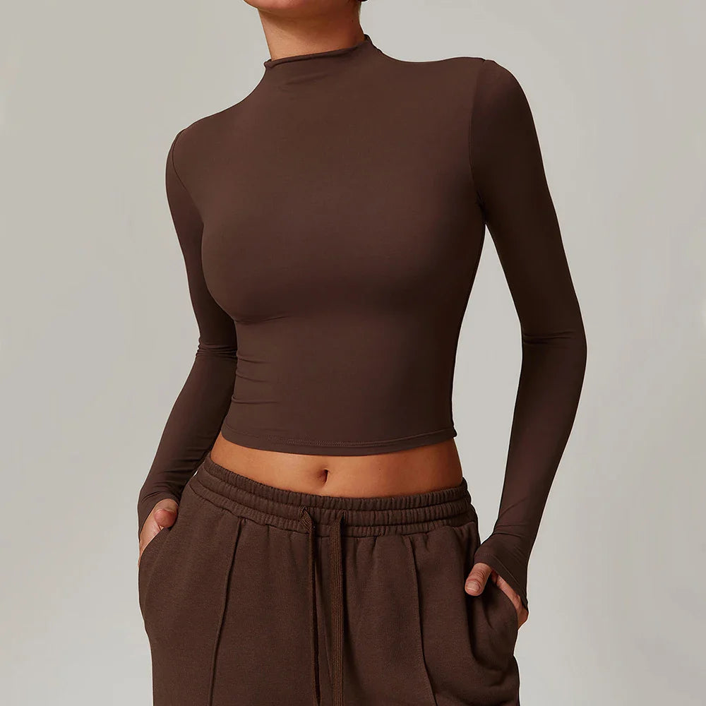 Dark brown long sleeve yoga cropped top with mock neck and thumbholes, ideal for sports yoga long sessions
