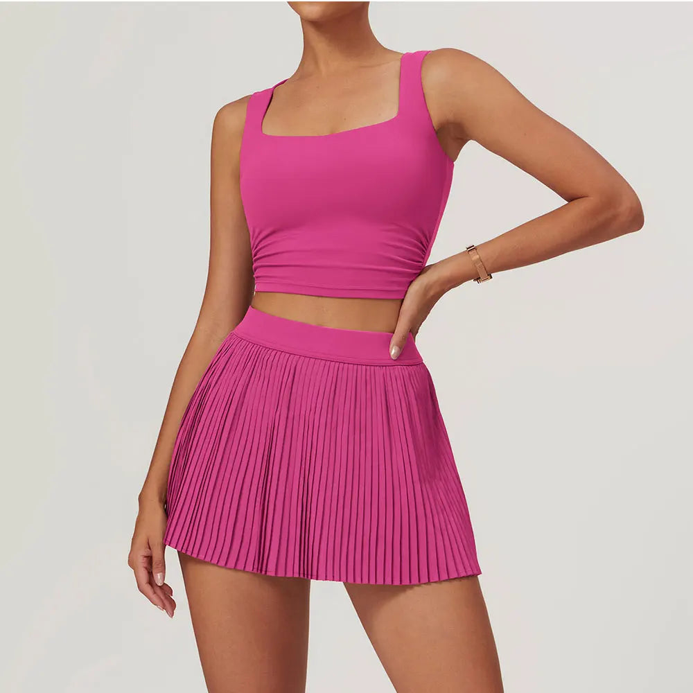 Fuchsia pink athletic 2pcs yoga set with crop top and pleated mini skirt