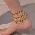 Three layered gold anklets with cubic zircon geometric pendants and charms