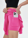 Pink high waisted tennis mini skirt with side phone pocket