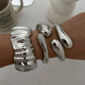 Irregular Water Drop Metal Wide Spring Bangles