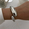 Irregular Water Drop Metal Wide Spring Bangles