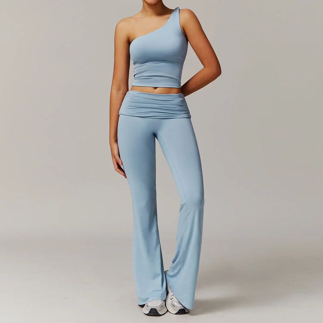 Light blue 2pcs yoga set: one-shoulder crop top and flared pants for women gym clothing