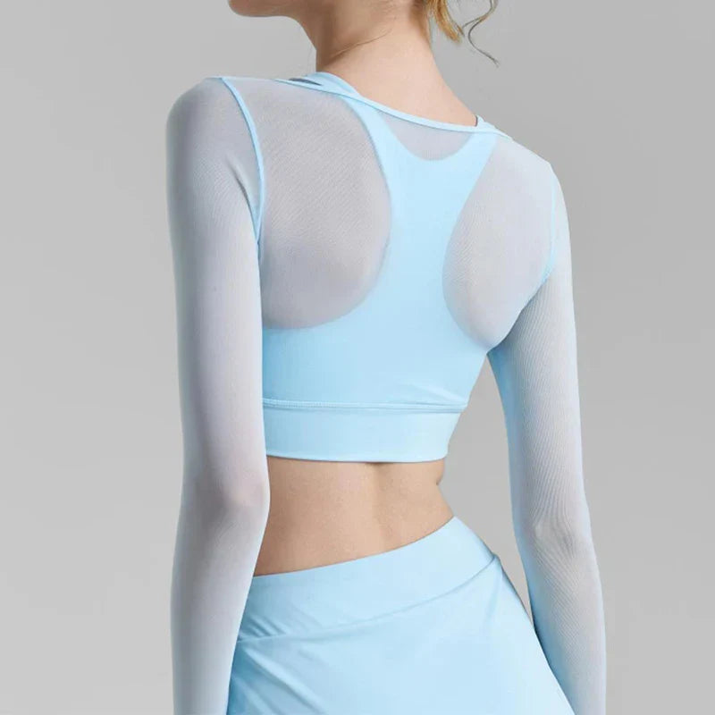 Light blue solid mesh long-sleeve sports top over sports bra