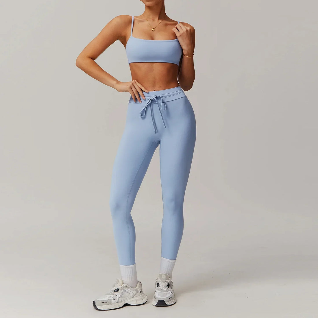 Light blue women tracksuit yoga set with crop top and flared sweatpants