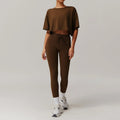 Woman modeling brown cropped t-shirt and matching leggings from Light Blue Womens Sportswear 2pcs Set