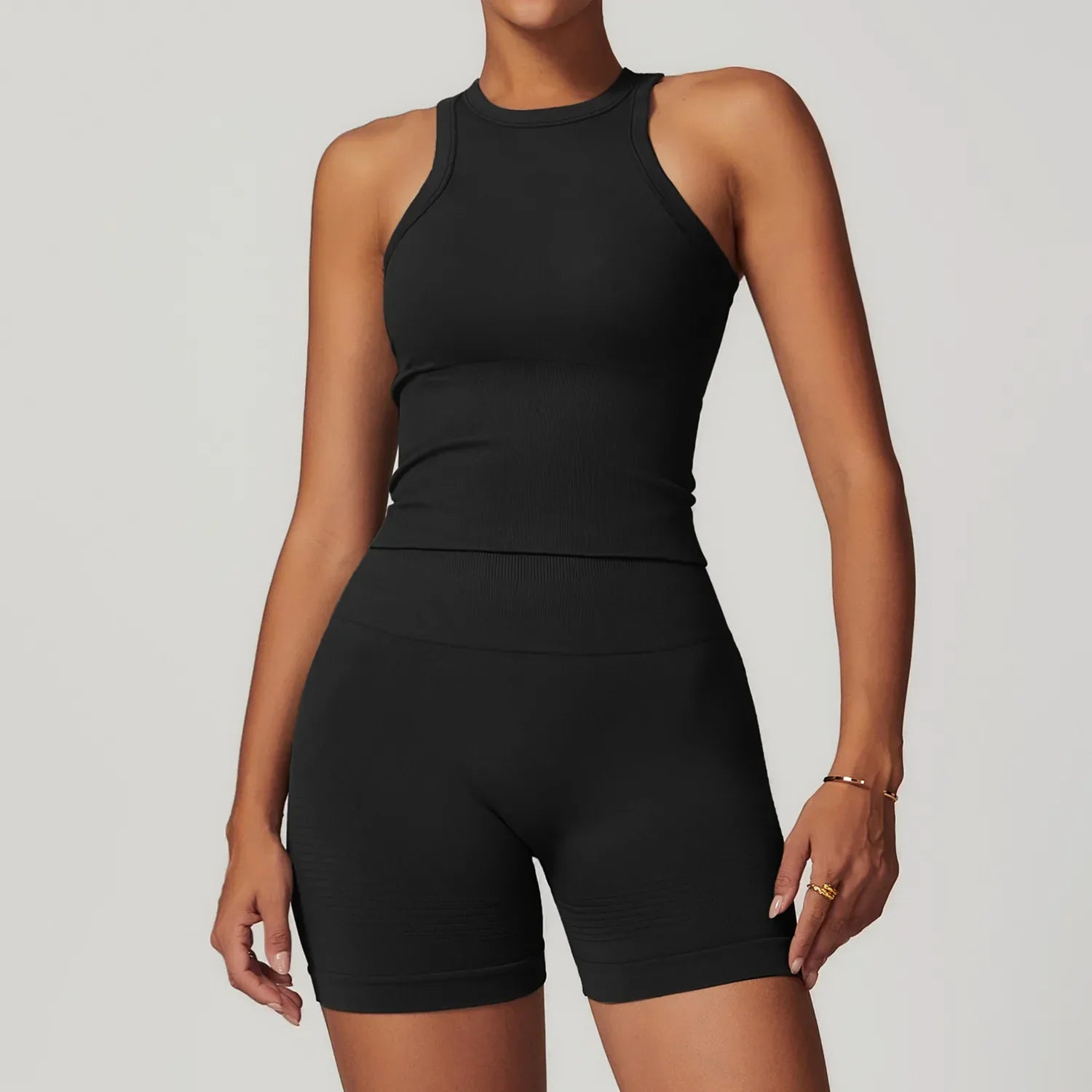 Light pink seamless gym set with ribbed tank top and biker shorts