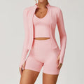 Light pink seamless gym set with jacket, crop top, and biker shorts