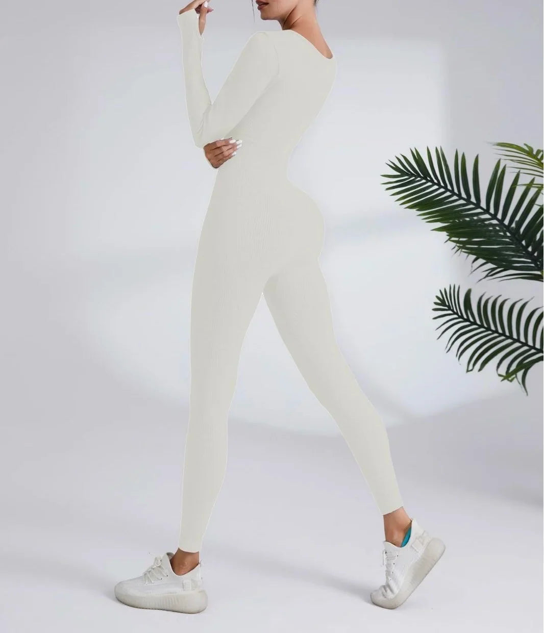 Full-length off-white athletic jumpsuit with thumbholes for quick dry running fitness sports