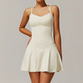 Off-white strappy mini dress with fitted bodice and flared skirt
