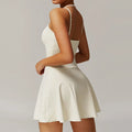 Cream off-white strappy mini dress with fitted bodice and flared skirt