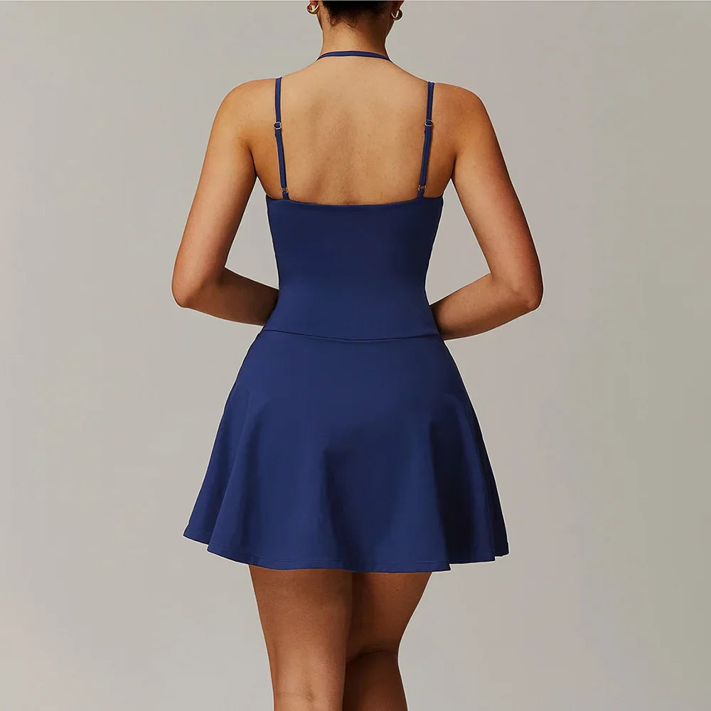 Navy blue strappy mini dress with fitted bodice and flared skirt