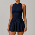 Plum sleeveless women yoga romper with navy mock neck and pleated skirt