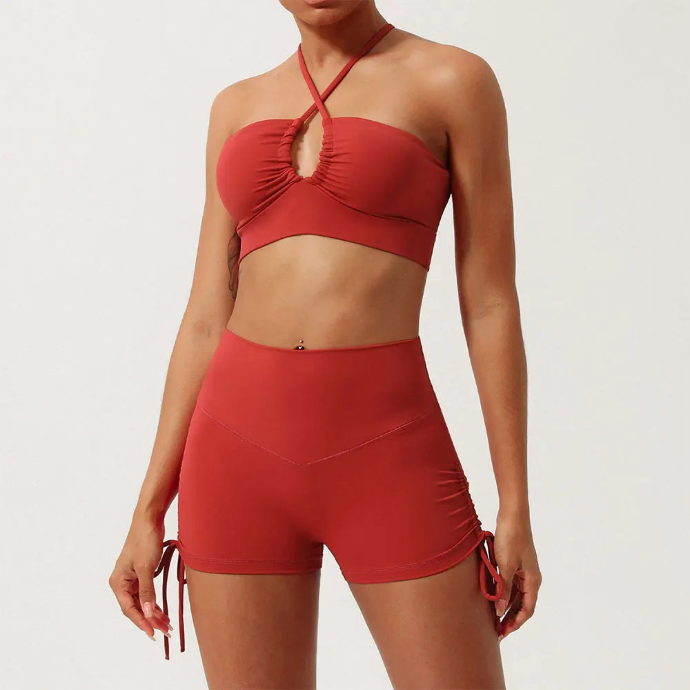 Rust halter neck yoga set with high-waisted ruched shorts