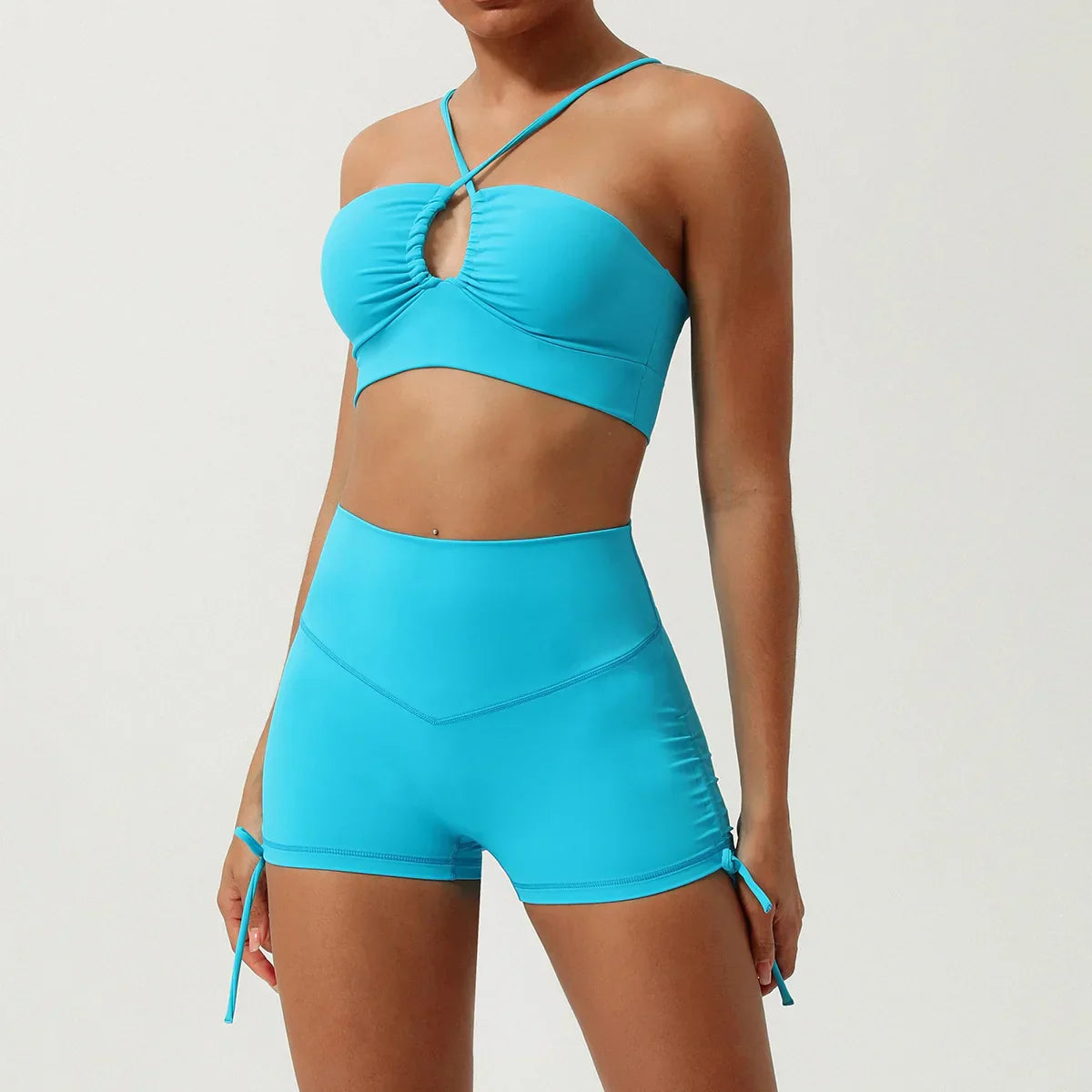 Rust halter neck yoga set with high-waisted ruched shorts