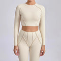 Light cream seamless yoga long sleeve cropped top with matching leggings
