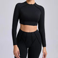 Light cream seamless yoga long sleeve cropped top with black leggings