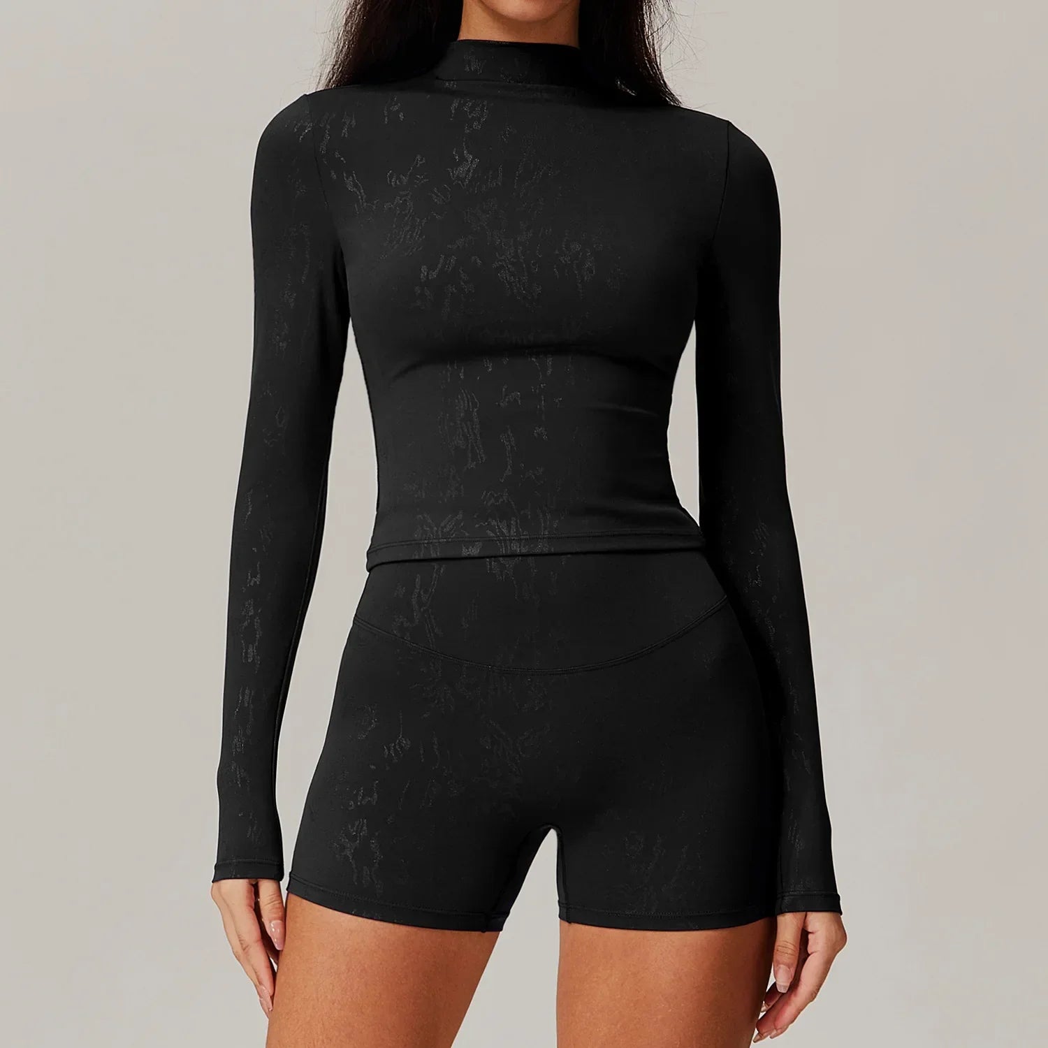 Black mock neck top and high-waisted biker shorts set for women yoga