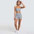 Woman in light grey leopard print 2pcs yoga set gym suit