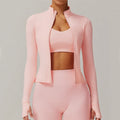 Light pink yoga long sleeve sports jacket with zip-up front, thumbholes, matching sports bra, high-waisted leggings