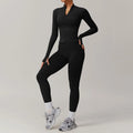 Woman modeling black long-sleeved yoga suit 2pcs sports set with matching leggings and sneakers